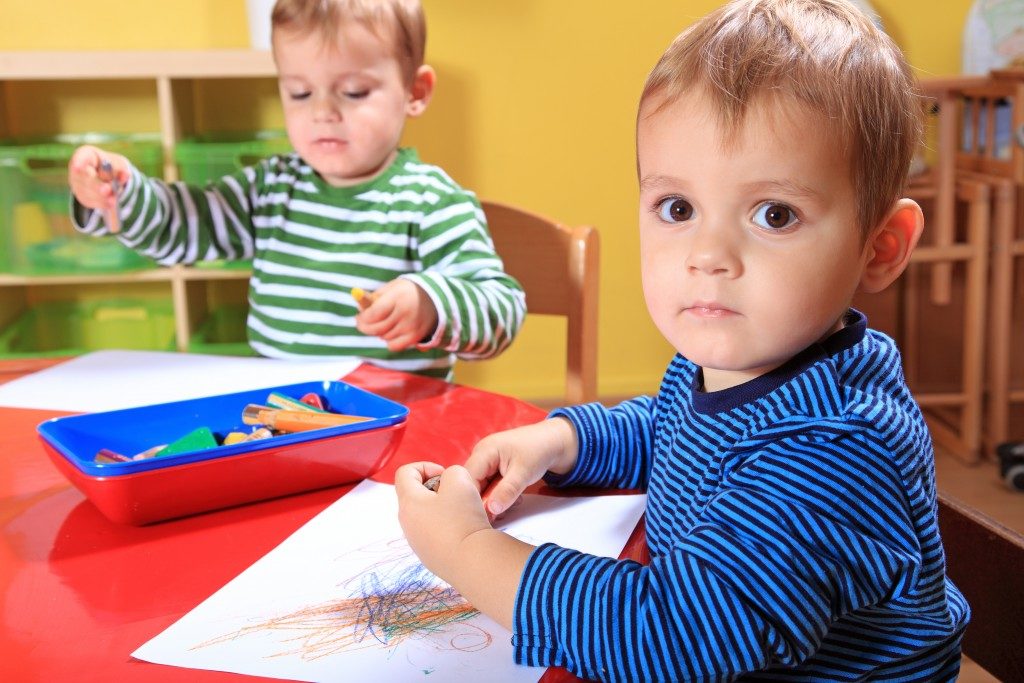 Two little boys coloring