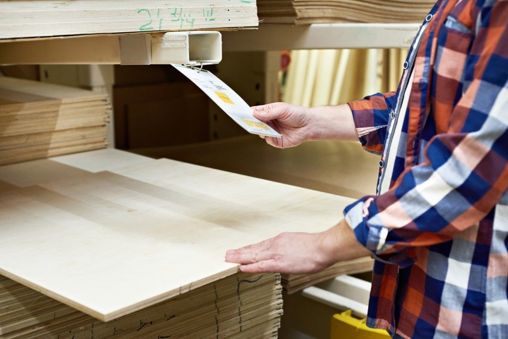 Man choosing a plywood to buy