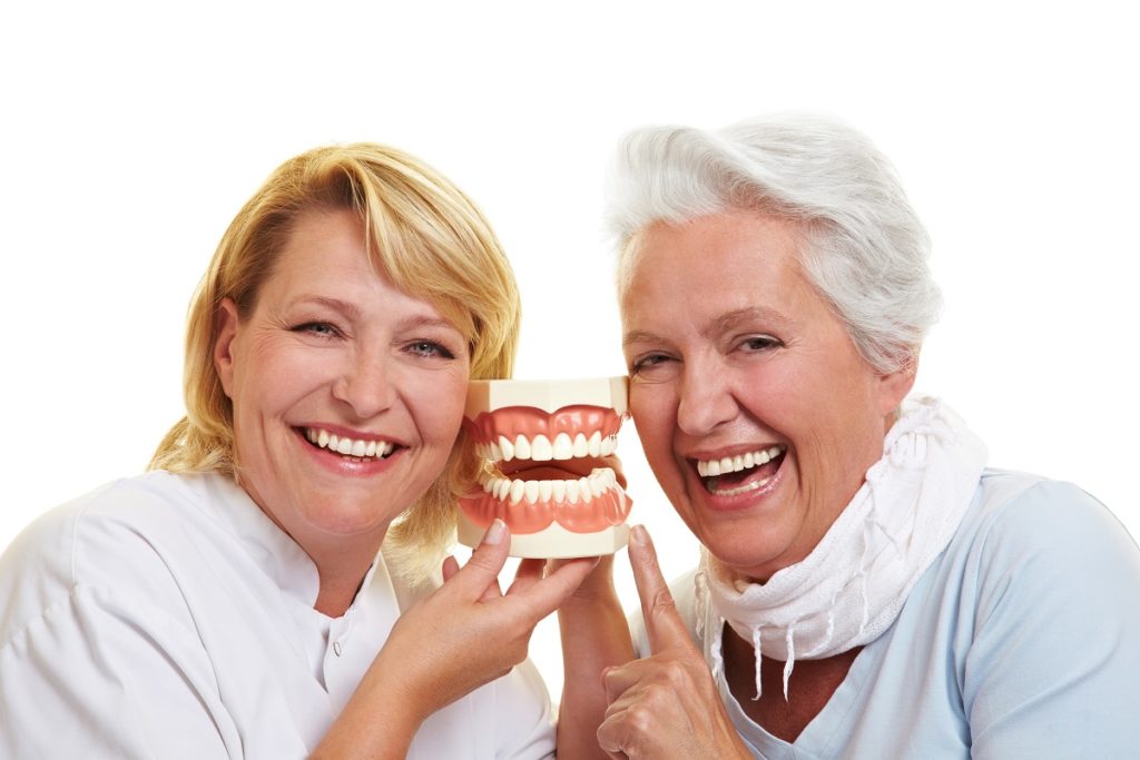 Women holding a teeth