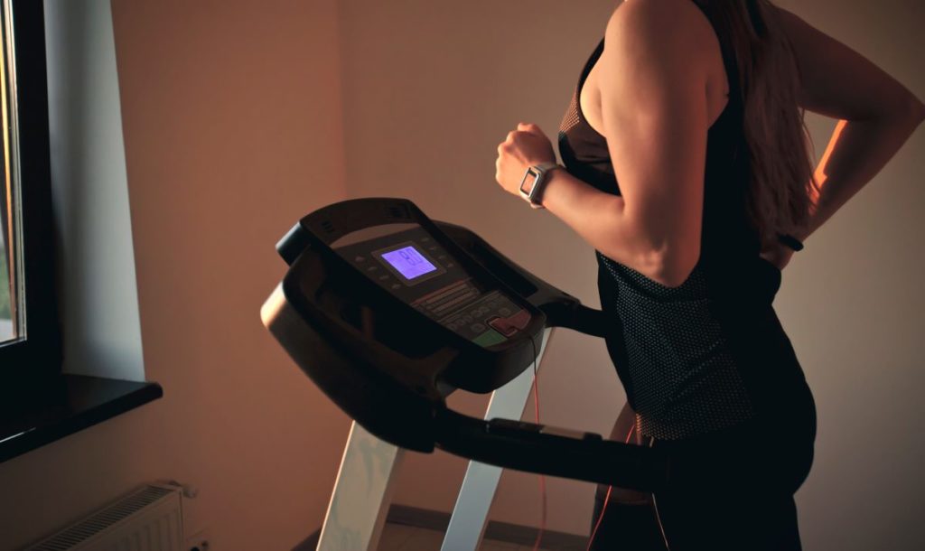 woman using her treadmill