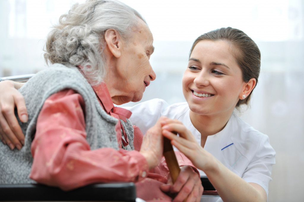 caregiver taking care of elderly